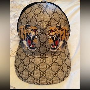 Brown Gucci Hat. Size is adjustable but will not fit bigger heads.
